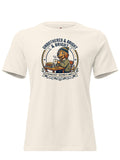 An off-white short-sleeve crewneck t-shirt featuring a vintage-style graphic of a lion wearing a blue cap and sitting at a desk with books, surrounded by the text 'UNBOTHERED & BRIGHT & BRAVE' and 'STUDYING TO KEEP IT SIMPLE'.