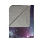 LuckeLadybug sherpa blanket with soft gray fleece and abstract galaxy bedding design on one side