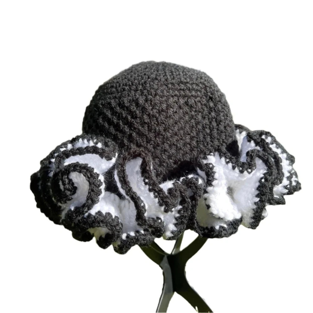 Handcrafted African hat with ruffle design in black and white colors for stylish headwear
