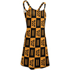 African print beach skirt dress with black and orange geometric patterns and thin straps