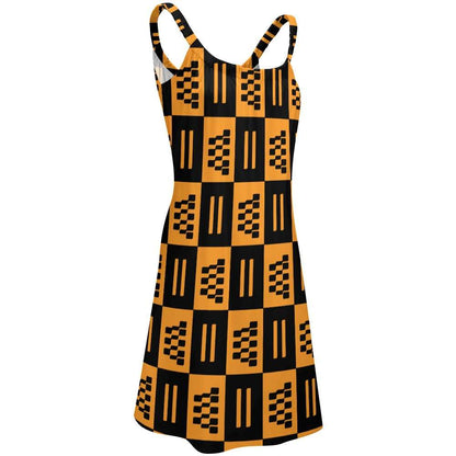 African print beach skirt dress with black and orange geometric patterns and thin straps