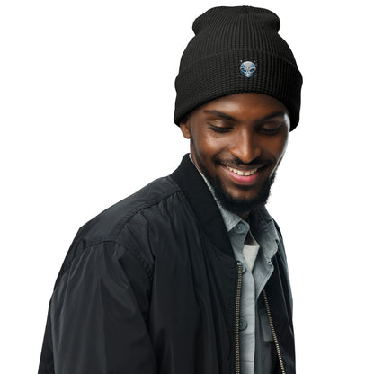 Black waffle beanie with alien embroidery waffle beanie detail worn by smiling man in casual jacket