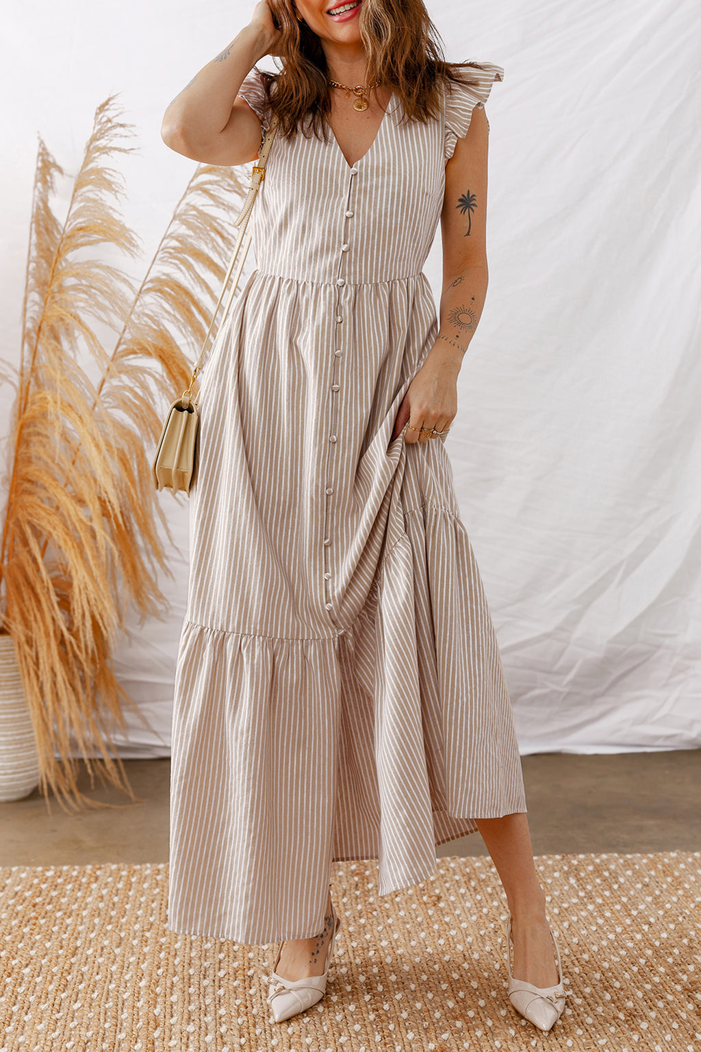 LuckeLadybug LLC Fit & Flare dress in striped pattern with ruffled sleeves and maxi dress design