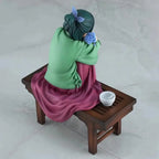 Anime figure of a girl sitting on a wooden bench with a rose and tea cup, detailed craftsmanship by LuckeLadybug LLC.