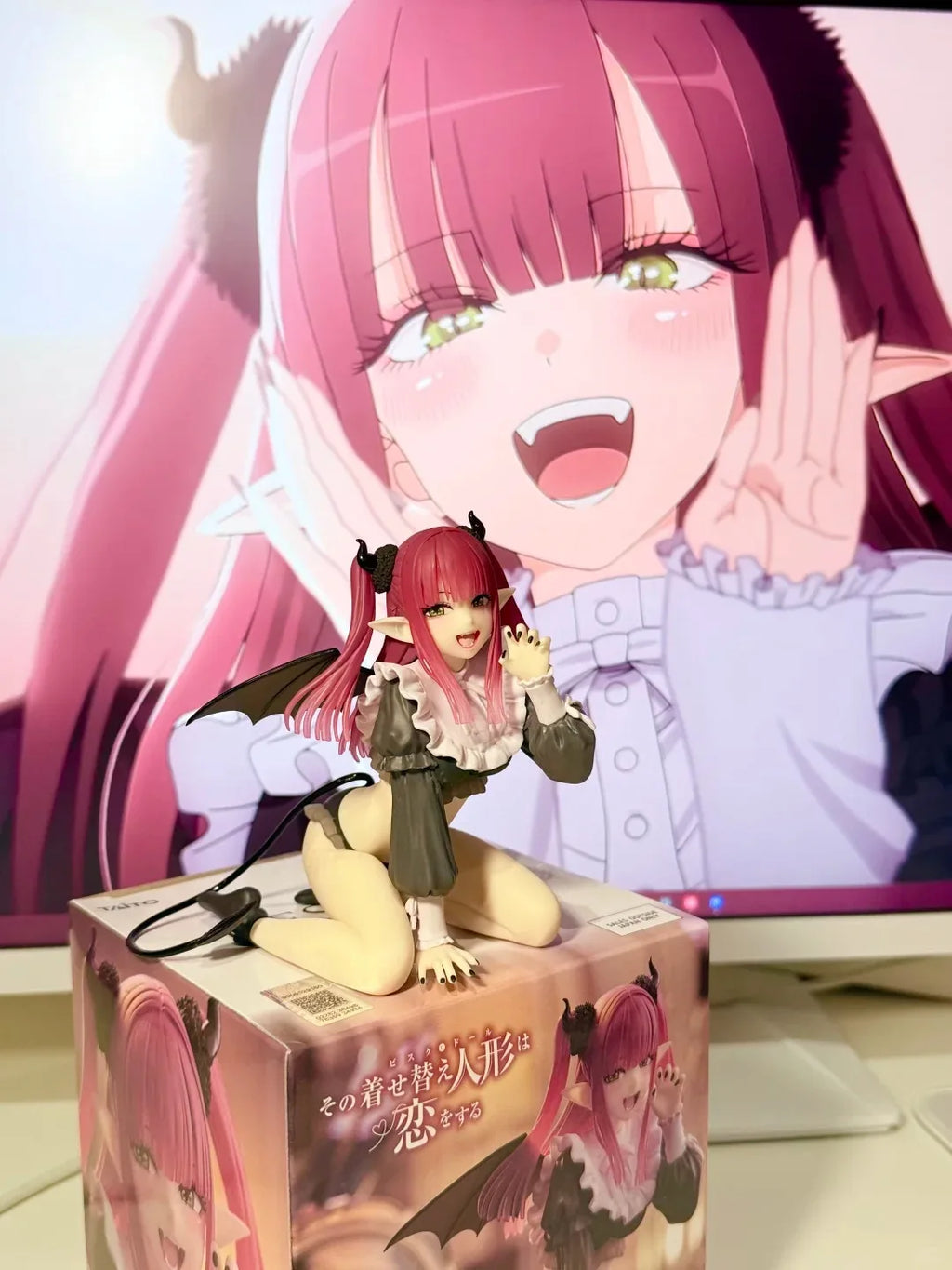 LuckeLadybug anime figure of a character with pink hair and devil-themed outfit standing on a box