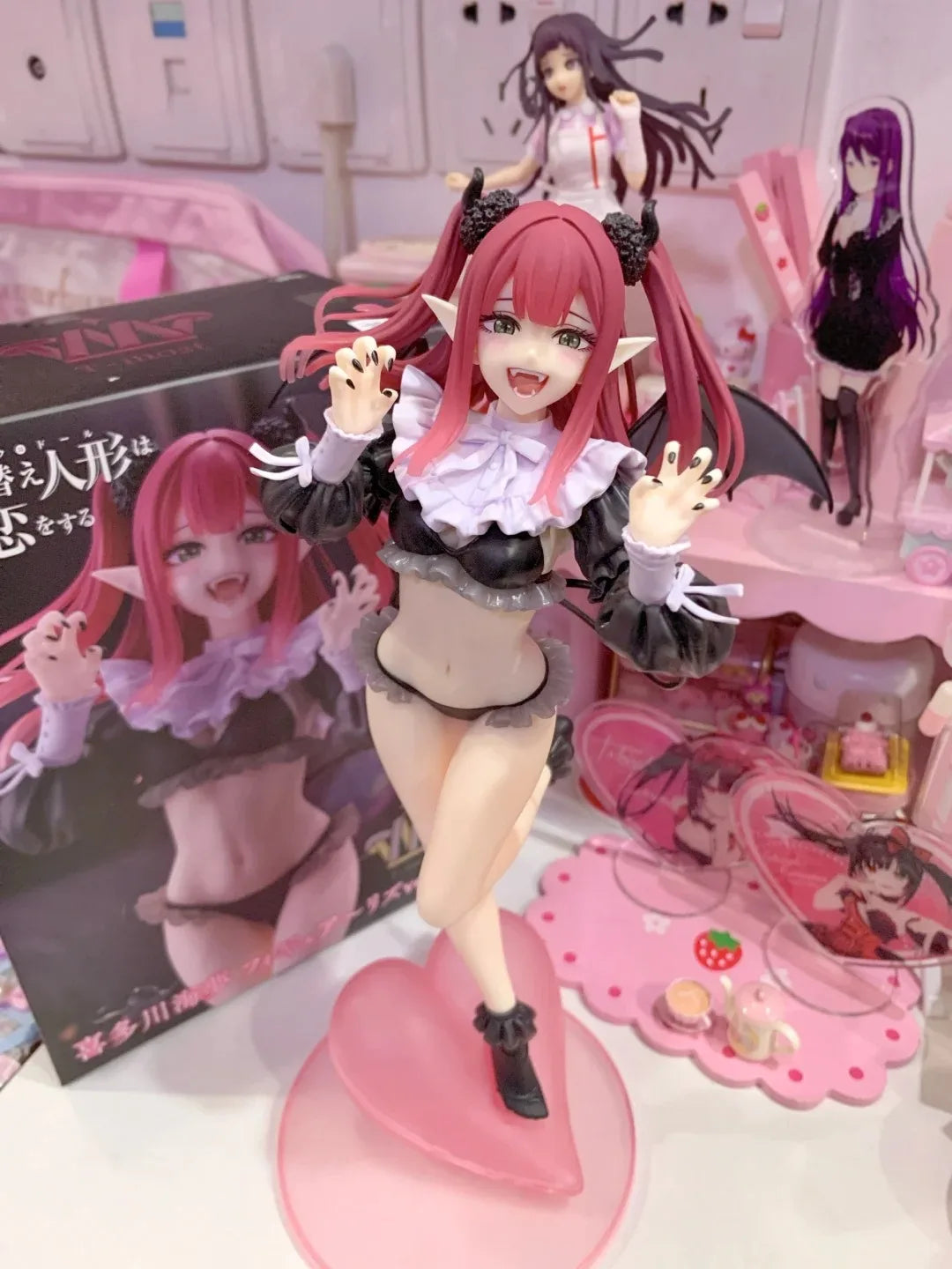 LuckeLadybug LLC anime figure of a character with pink hair and playful pose in a stylish outfit