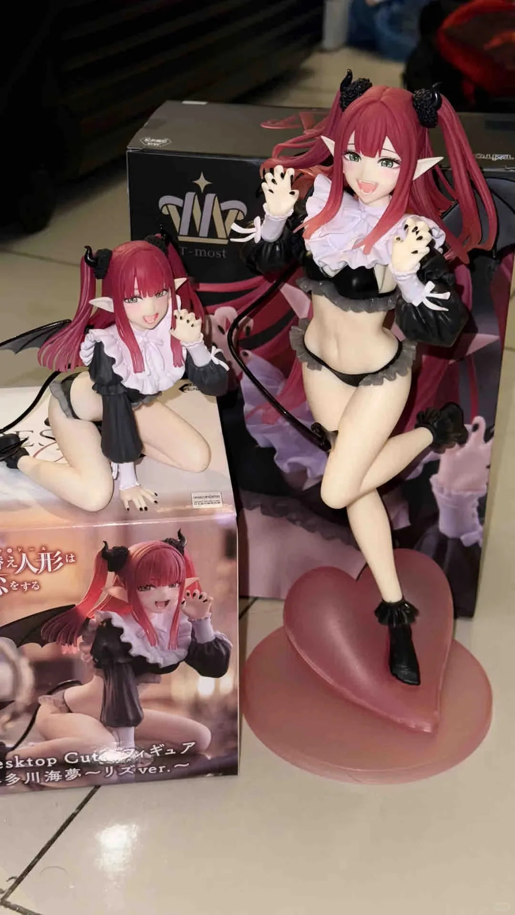 LuckeLadybug anime figure with detailed design and heart-shaped base, standing beside its packaging