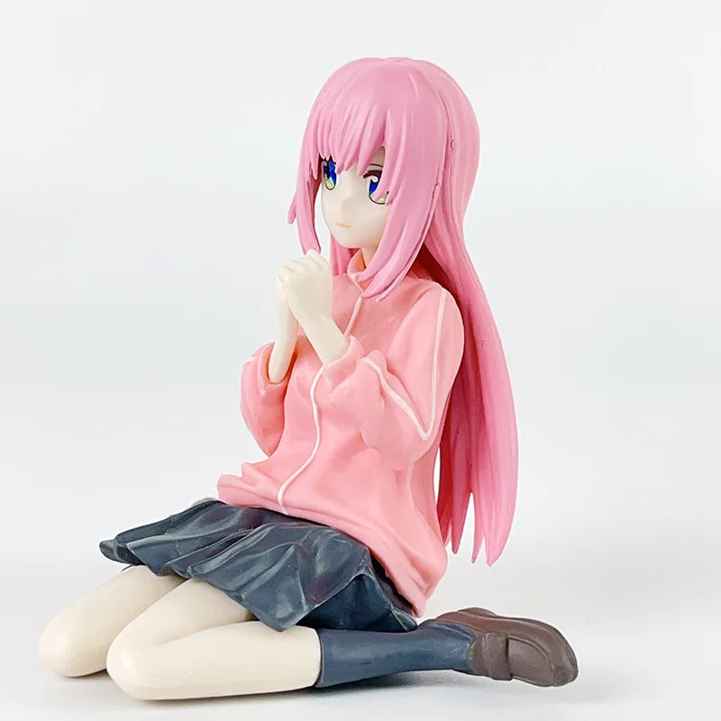 LuckeLadybug LLC anime figure of a girl in a pink hoodie, seated with long pink hair