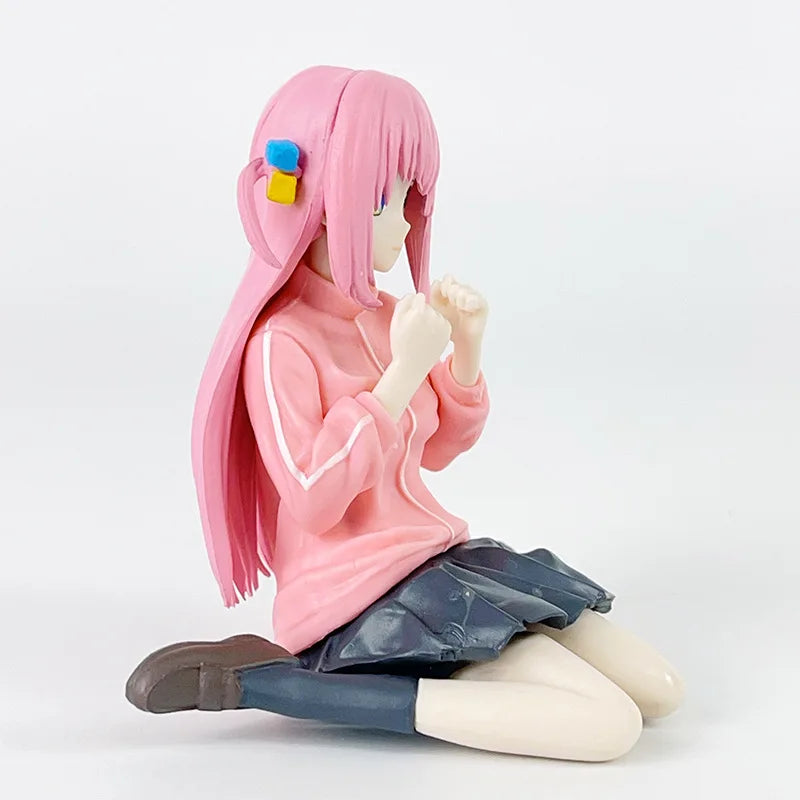 LuckeLadybug LLC anime figure of a girl sitting with pink hair and a pink sweatshirt