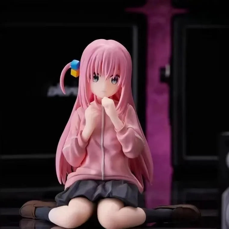 LuckeLadybug LLC anime figure of a girl with pink hair sitting in a cute pose, wearing a pink hoodie