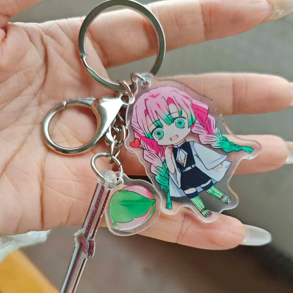 LuckeLadybug LLC anime figure keychain of a character with pink hair and green details