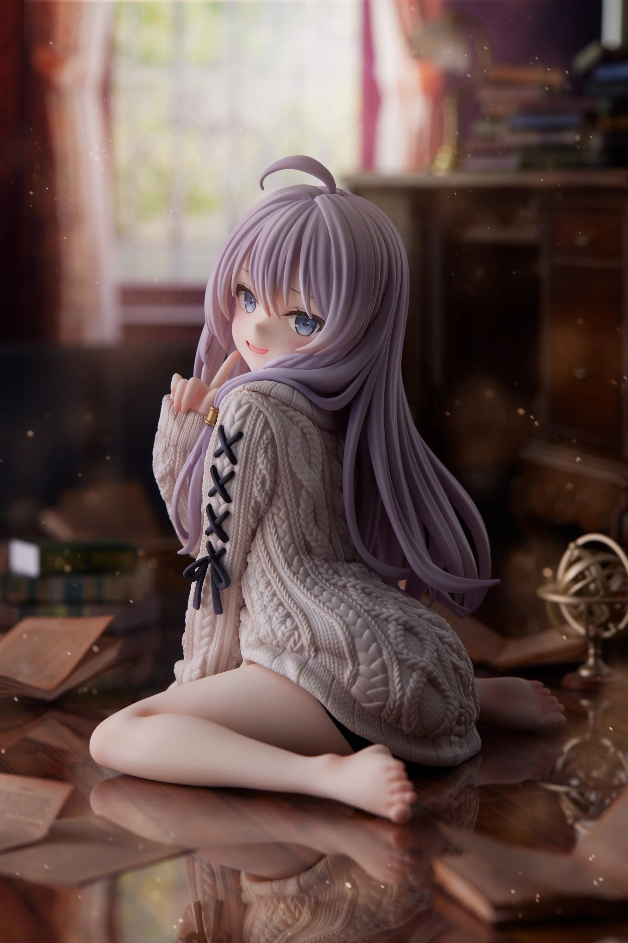Anime figure of a girl in a cozy sweater sitting on a table with a warm background