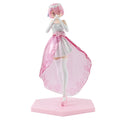 Anime figure of a girl with pink hair in a white dress and pink skirt, posed on a hexagonal base