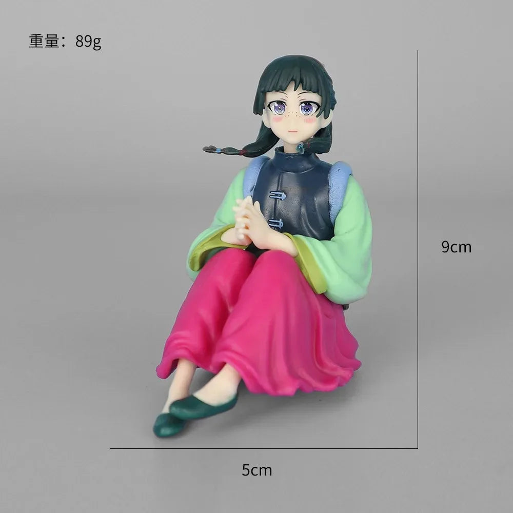 LuckeLadybug LLC anime figure featuring a character sitting with a colorful outfit and detailed expression