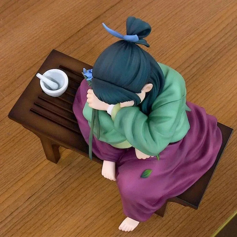 LuckeLadybug anime figure of a girl sitting on a bench, wearing a green top and purple skirt