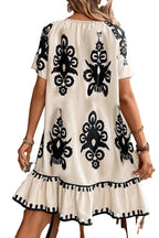 LuckeLadybug apricot western print dress with black floral designs and ruffled hem