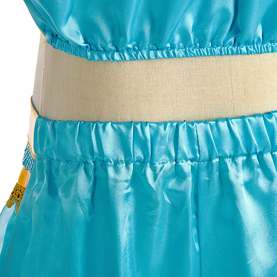 Close-up of the top of an Arabian princess costume for girls with a vibrant blue satin finish