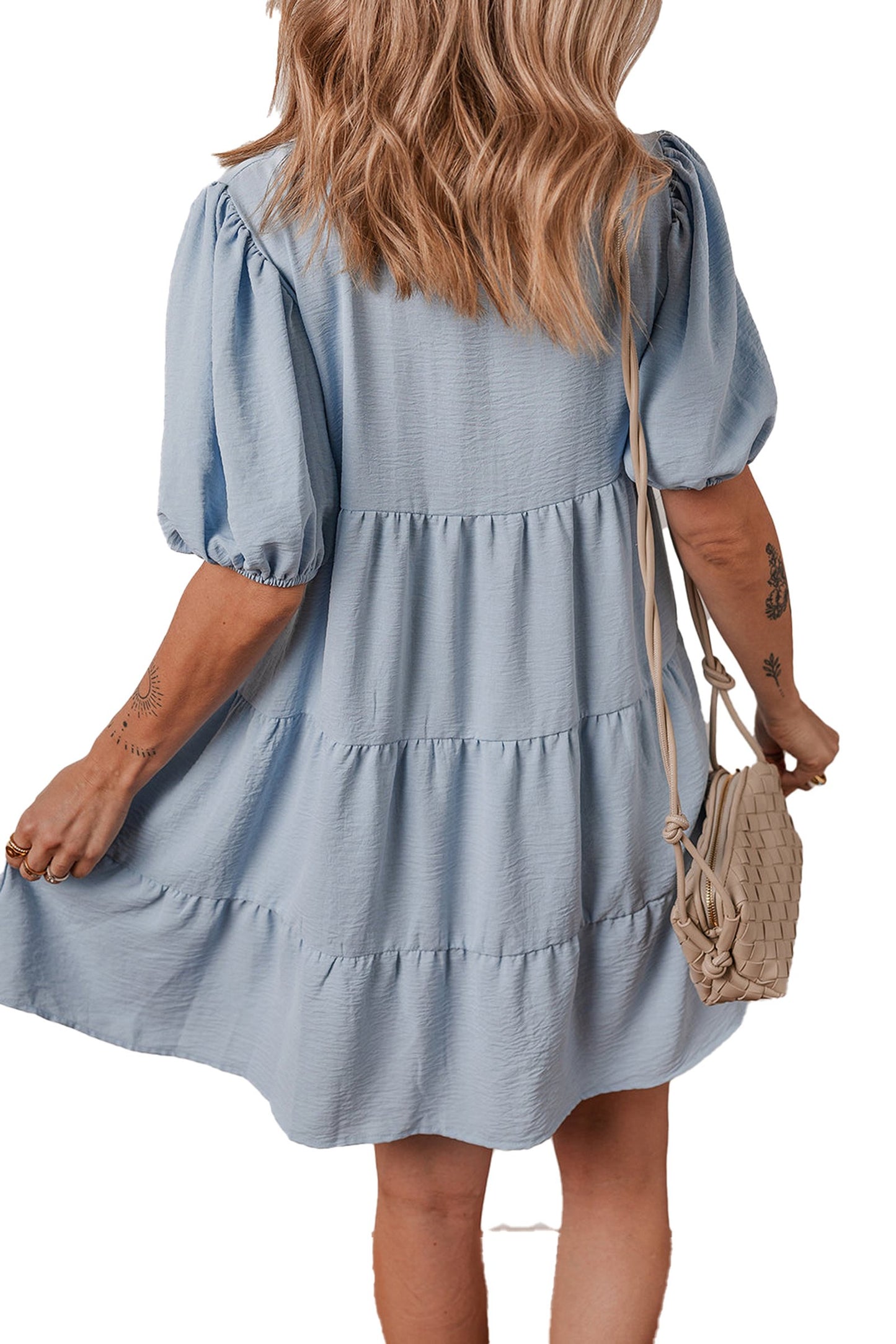 Back view of model wearing LuckeLadybug H Line blue shirt collar puff sleeve dress with tiered skirt