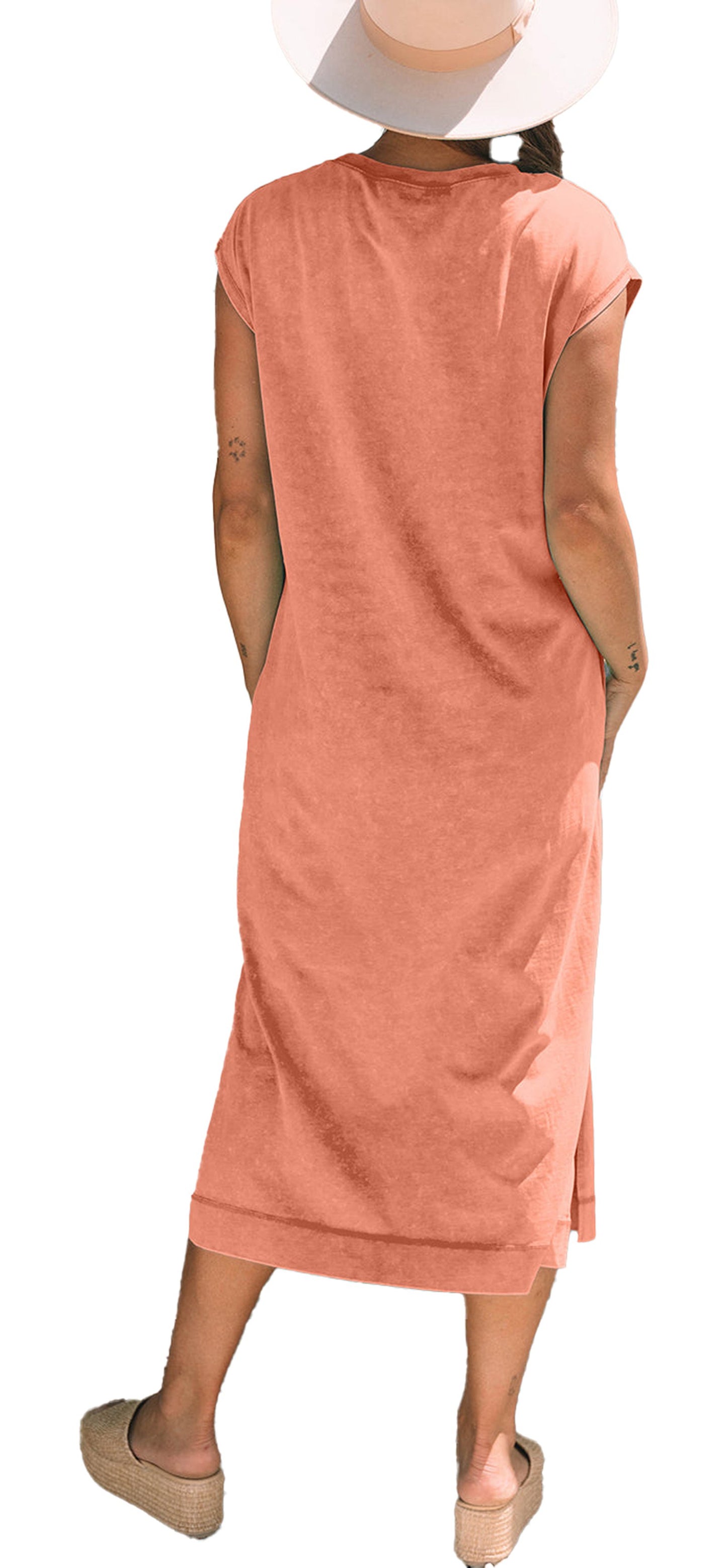 Back view of woman wearing carrot mineral wash t-shirt dress midi length short sleeves hat and espadrilles