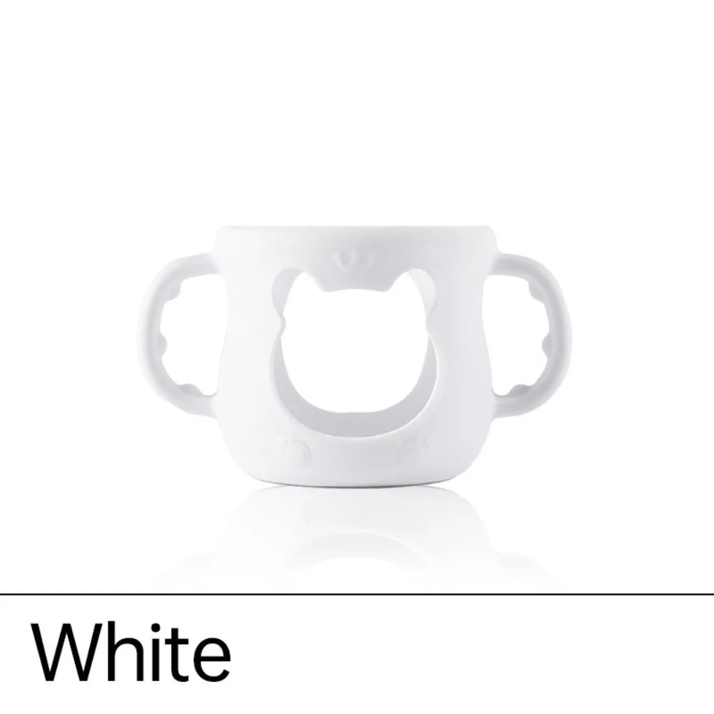 White silicone cover designed for a baby bottle warmer with cute bear handles