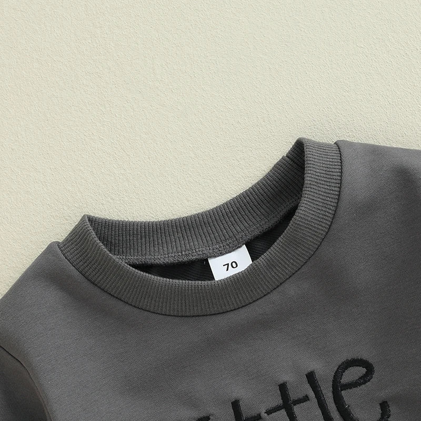 Gray baby boy Halloween romper featuring soft fabric and playful design for festive celebrations