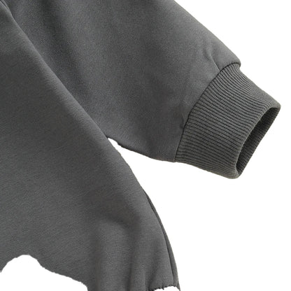 Soft gray fabric of a baby boy Halloween romper with snug cuffs for comfort and style