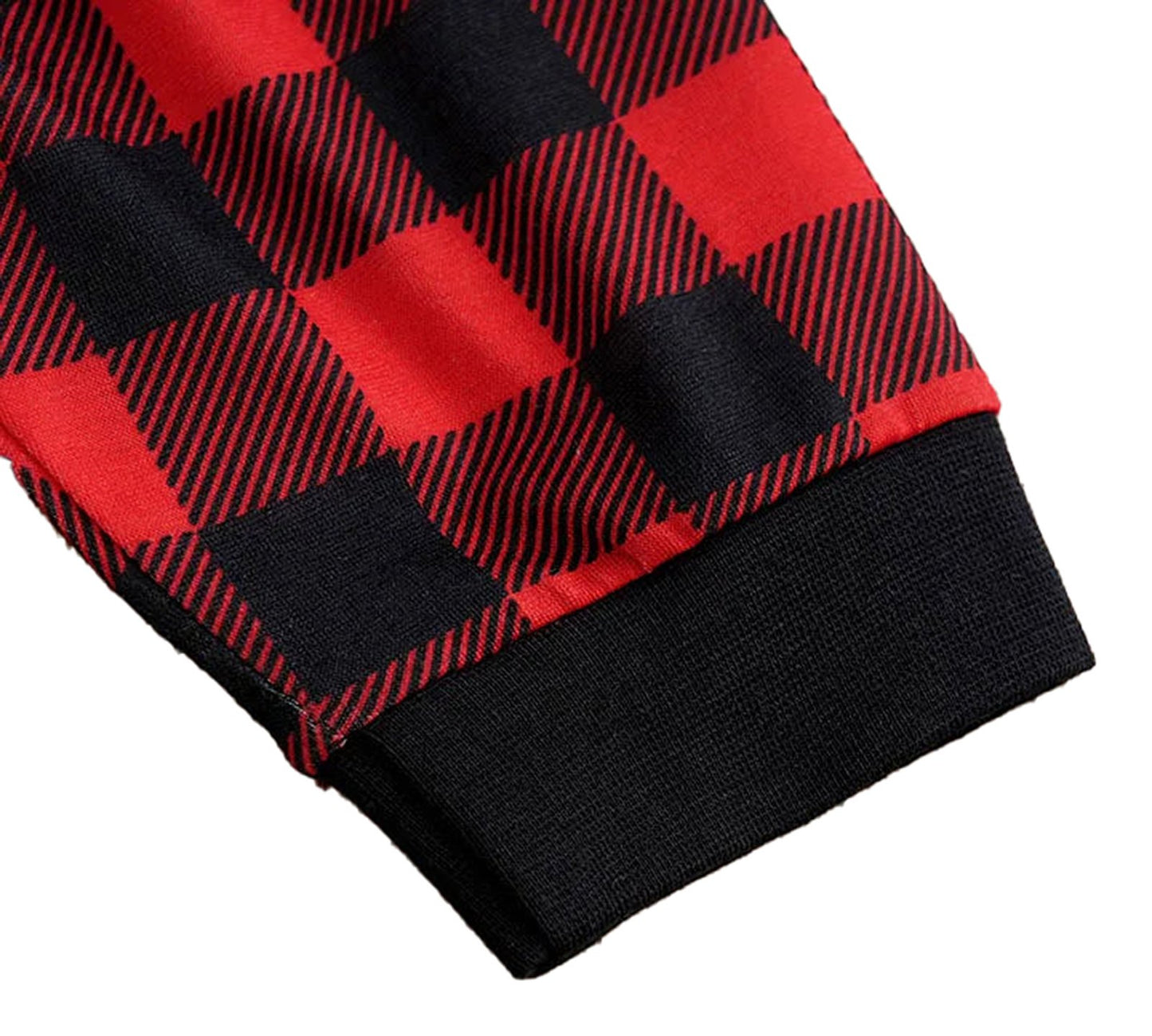 Close-up of the cuff from a baby Christmas outfit set featuring a red and black checkered pattern