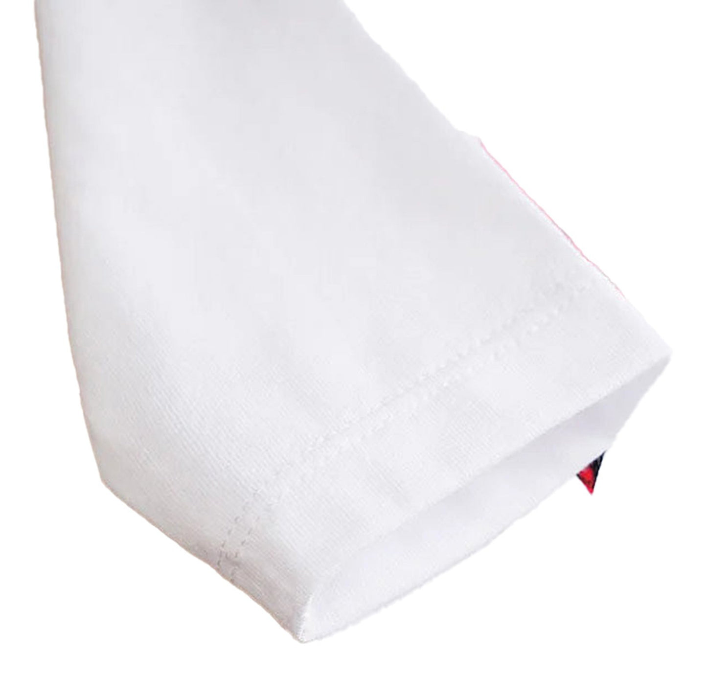 Close-up of a white sleeve from a baby Christmas outfit set featuring festive design elements