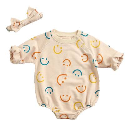 Baby girl autumn bodysuit with colorful smiley face pattern and matching headband for cozy fall wear