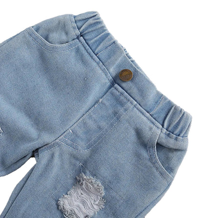 Close-up of light blue jeans with distressed details for baby girl lace romper and jeans set