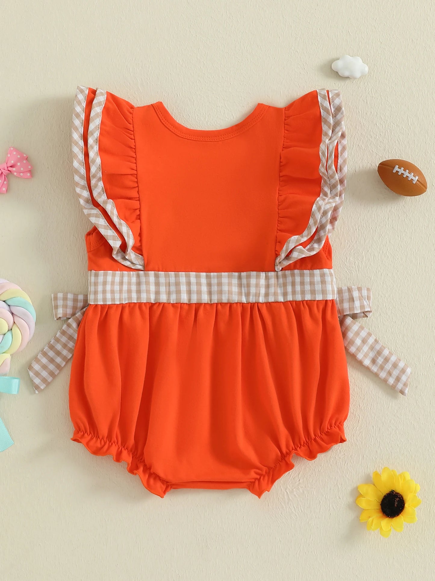 Cute orange baby girl rugby romper with ruffled sleeves and checkered waistband for stylish infants