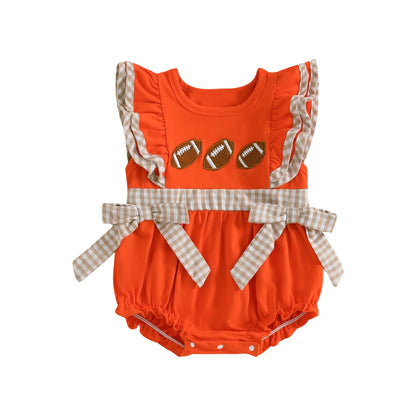 Bright orange baby girl rugby romper with ruffled sleeves and football accents