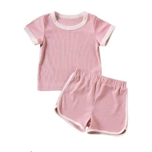 Pink baby short sleeve T-shirt and shorts set with white trim by LuckeLadybug LLC