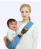 LuckeLadybug baby sling in blue, comfortably holding a baby with a smile on a parent’s shoulder.