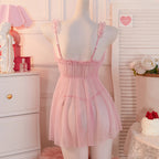 Pink babydoll dress with delicate straps and sheer fabric for a romantic look