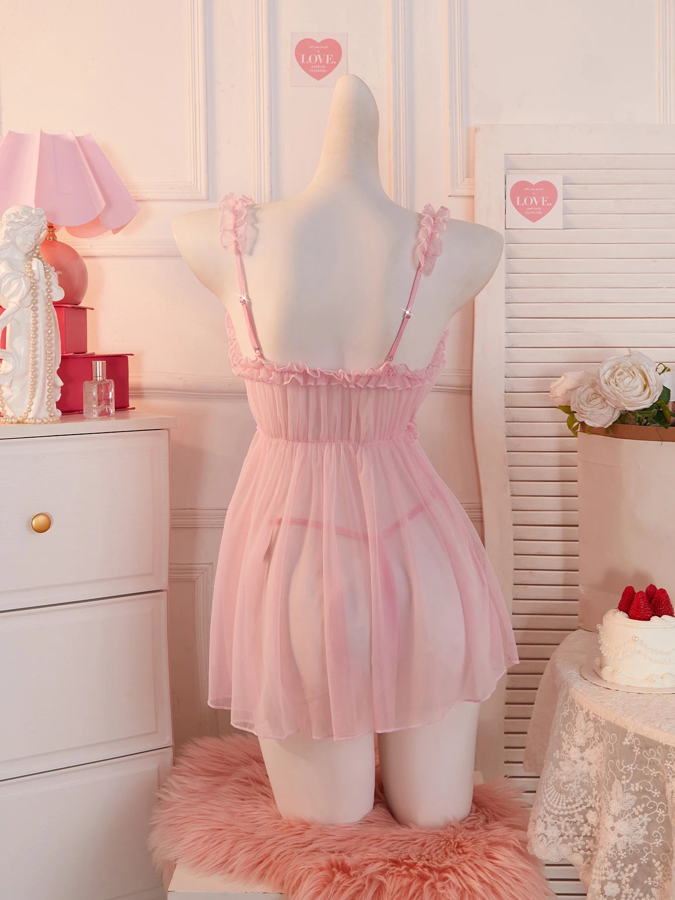 Cute pink babydoll dress with adjustable straps and ruffled details for a flirty look