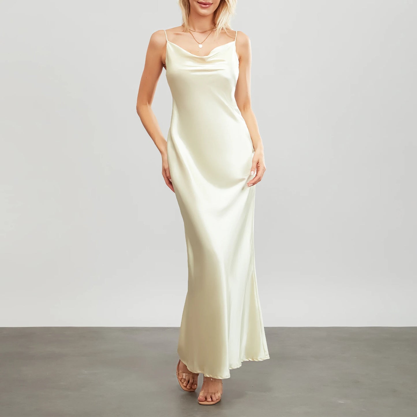Elegant backless satin evening gown for women in soft cream color, perfect for formal occasions