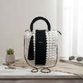 Stylish black and white crochet bag for crochet with tassel and adjustable strap by ThreadsByHannah