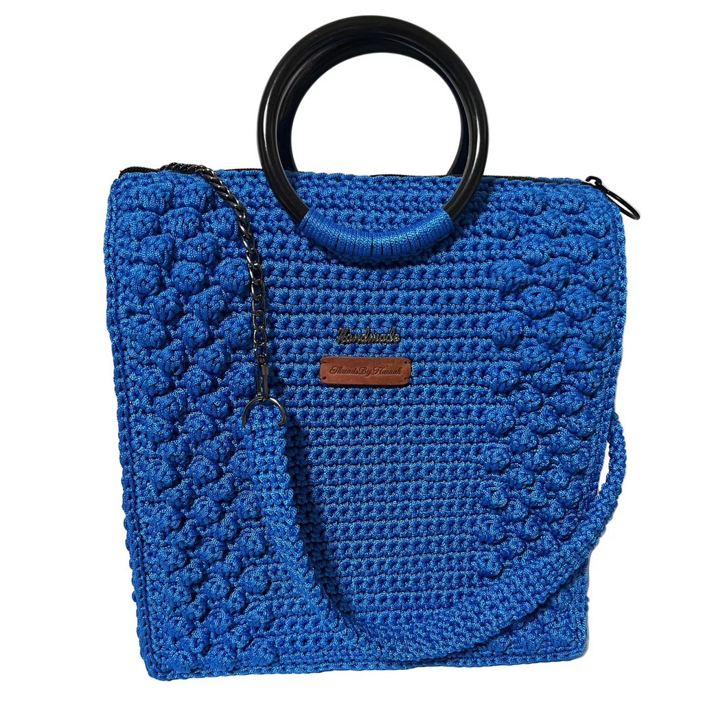 Blue crocheted tote bag for crochet with stylish handles and versatile design
