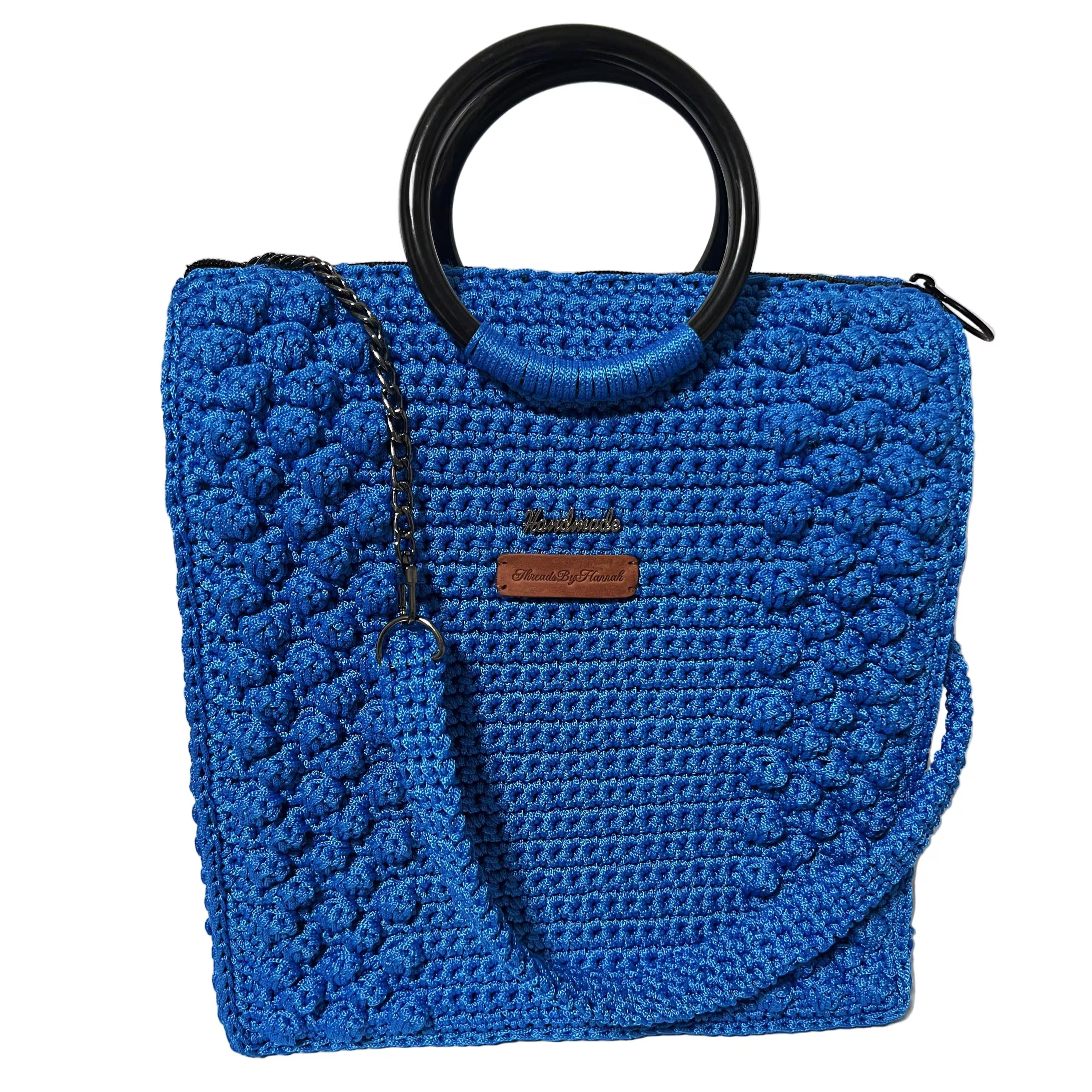 Blue crocheted tote bag for crochet with stylish handles and versatile design