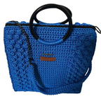 Blue crochet tote bag for crochet with black handles and a stylish design