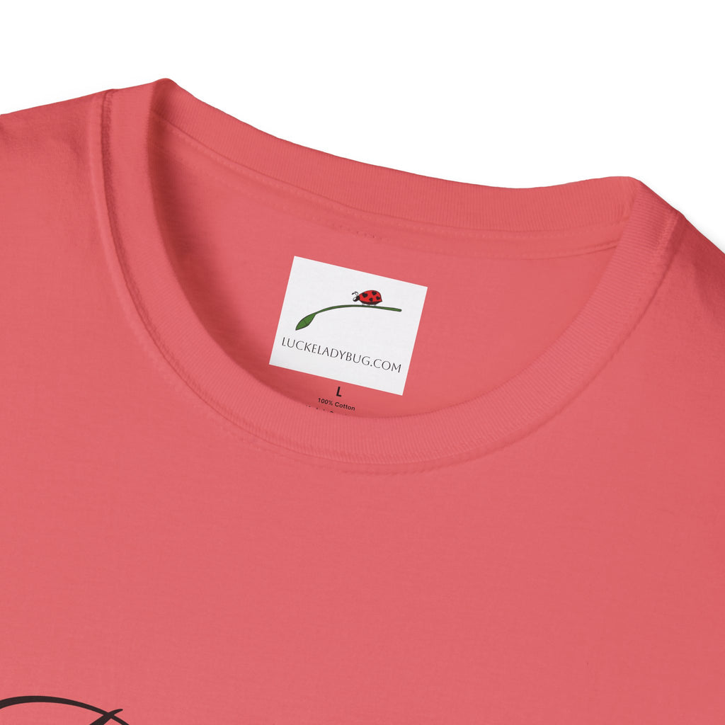 Close up of coral LuckeLadybug be still bible verse t shirt collar and tag