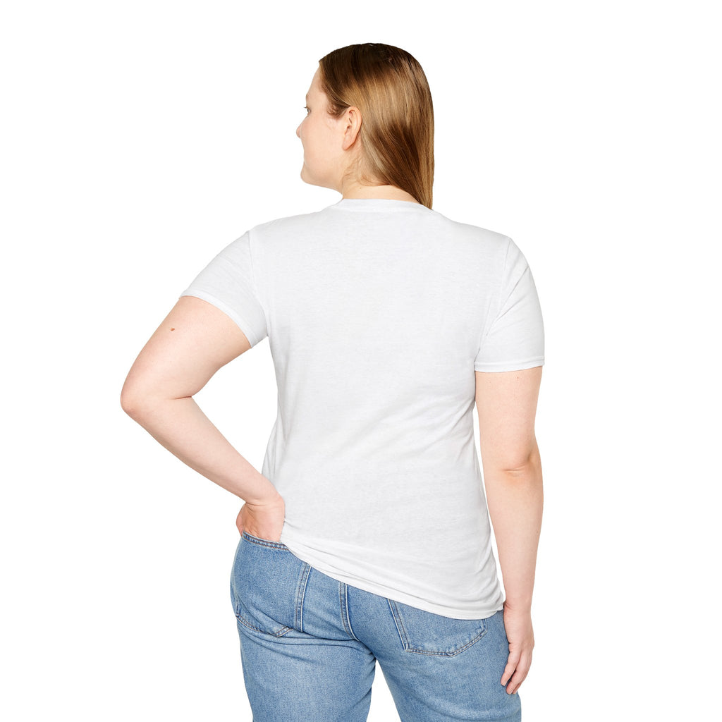Back view of a woman wearing white be still bible verse t shirt and blue jeans