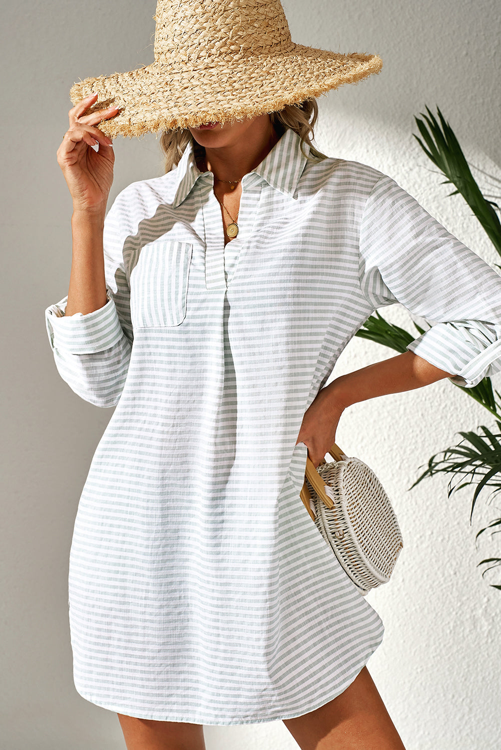 Lightweight striped cover up for the beach with a collar and front pocket, perfect for summer days