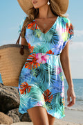 Tropical-print cover up for the beach with a flattering v-neck and cinched waist, perfect for summer outings