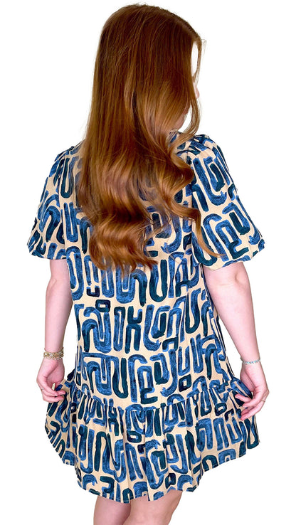 Beige abstract print mini dress from LuckeLadybug with a playful design and flowy fit