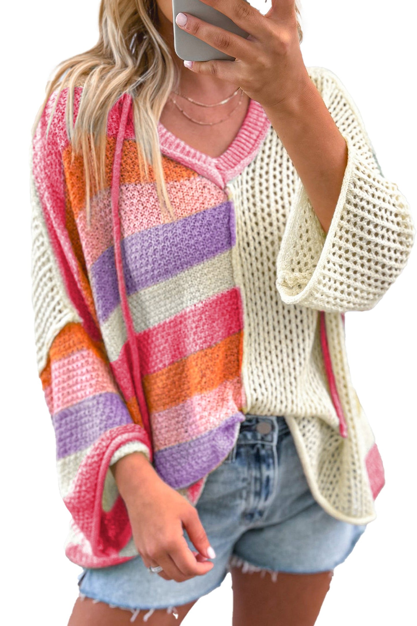Beige oversized colorblock sweater with vibrant stripes, perfect for stylish layering and comfort