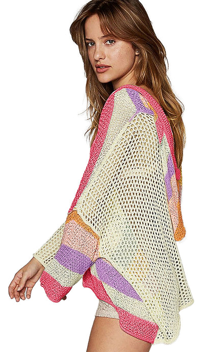 Beige oversized colorblock sweater with vibrant stripes and a loose fit for a trendy look