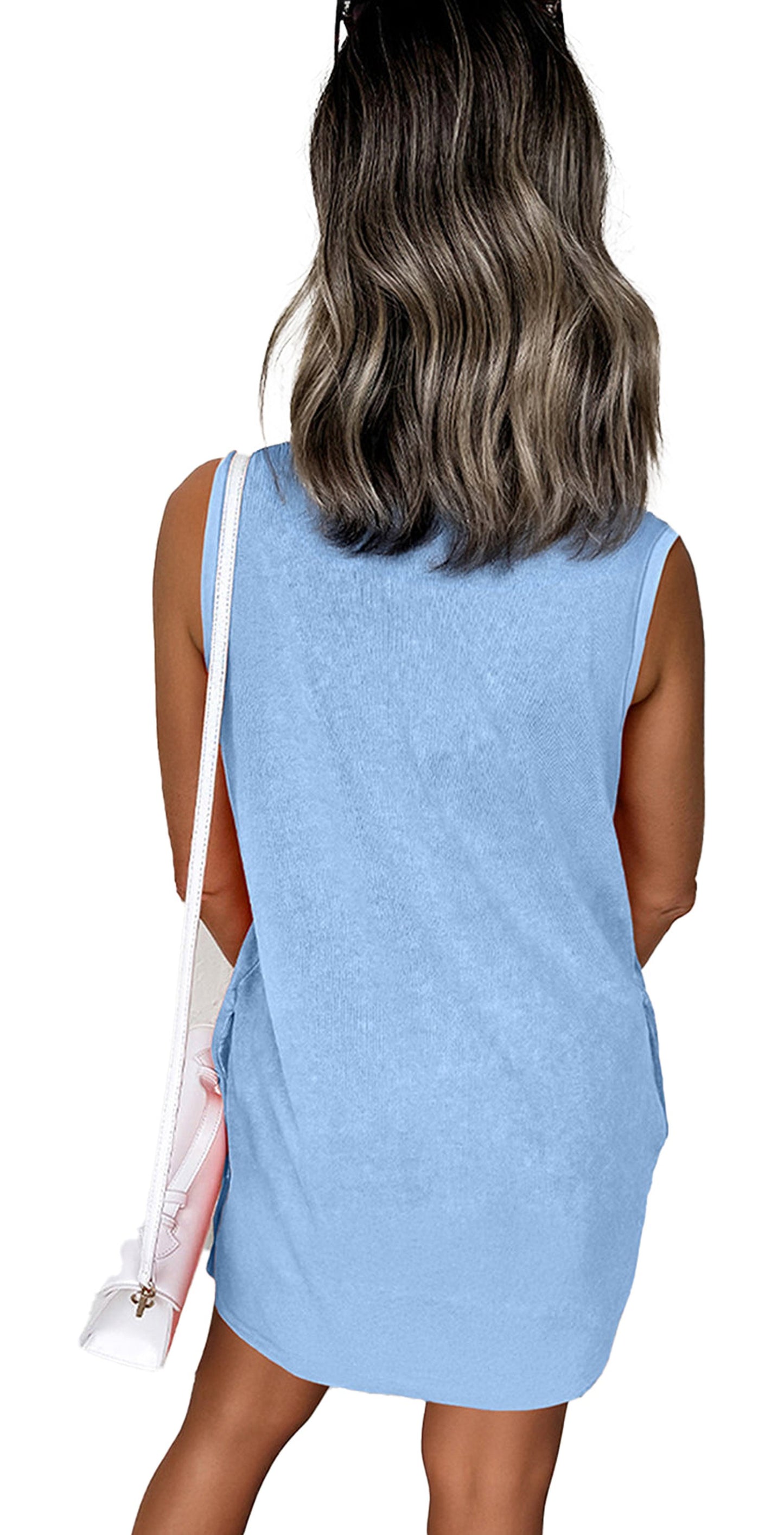 Back view of model in light blue Phalaenopsis tank mini dress with pockets. Casual sleeveless summer style with crossbody bag