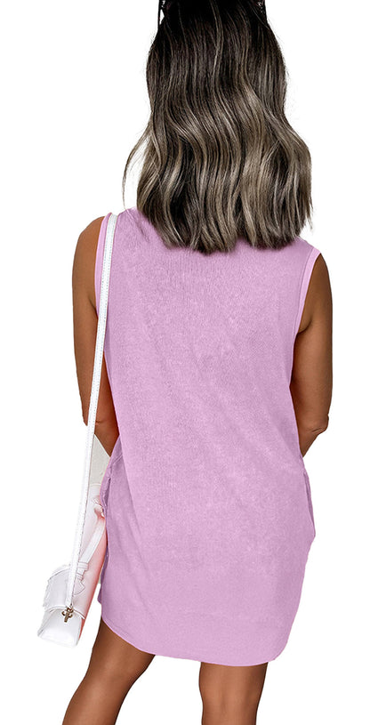 Back view of woman wearing Phalaenopsis tank mini dress with pockets. Lavender pink sleeveless style with white shoulder bag